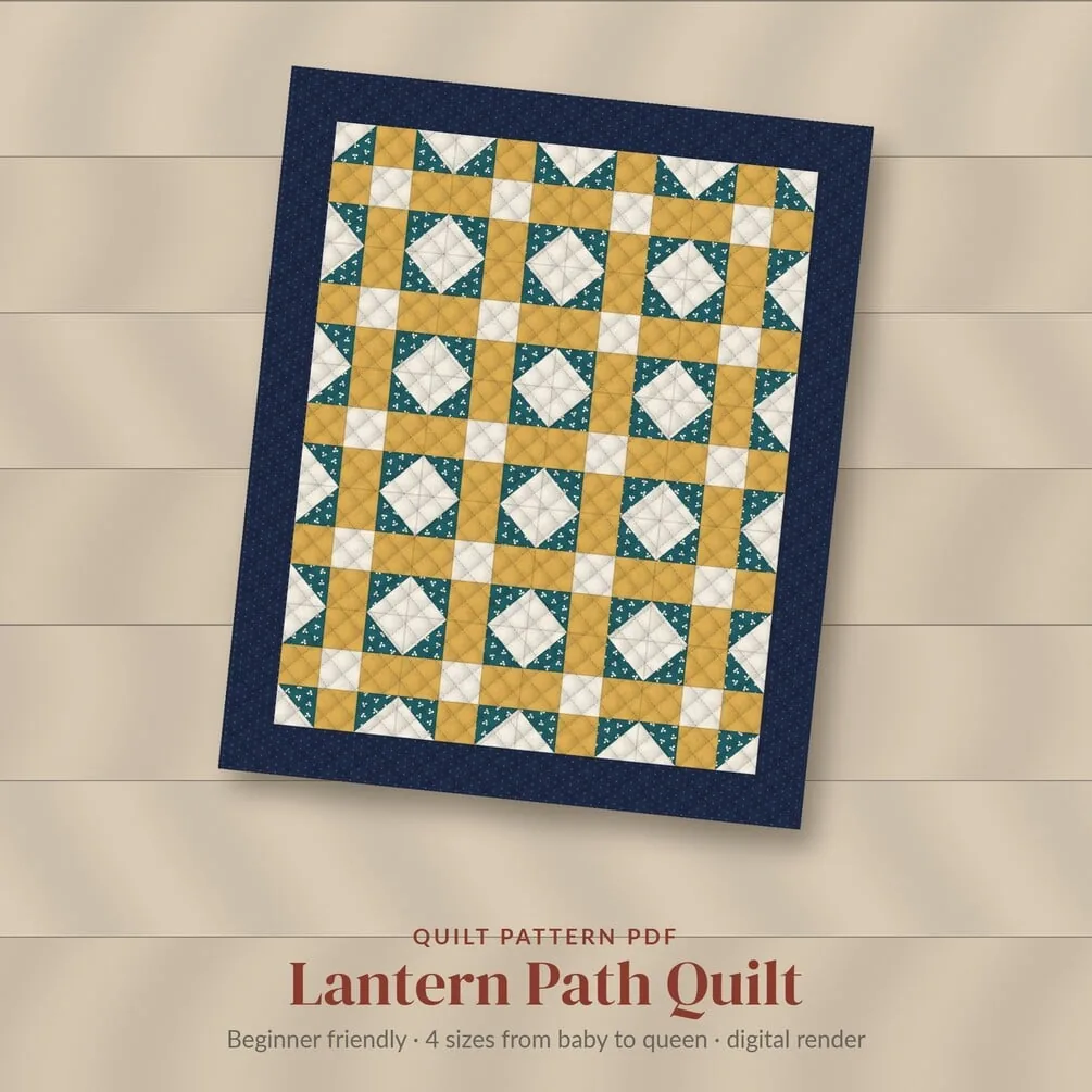 The Lantern Path quilt in teal, gold and cream with a navy border, where the light corners of the blocks form rows of diamonds. A digital render, not a photo of a sewn quilt.